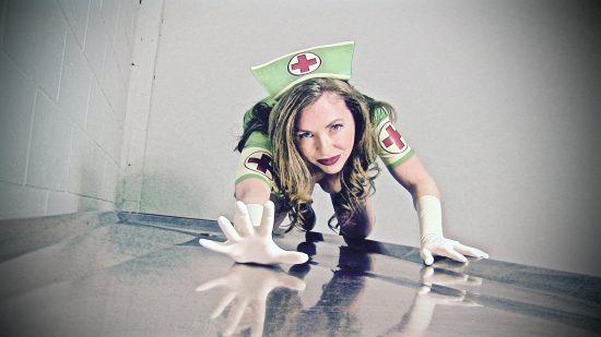Mistress T in a green nurses outfit